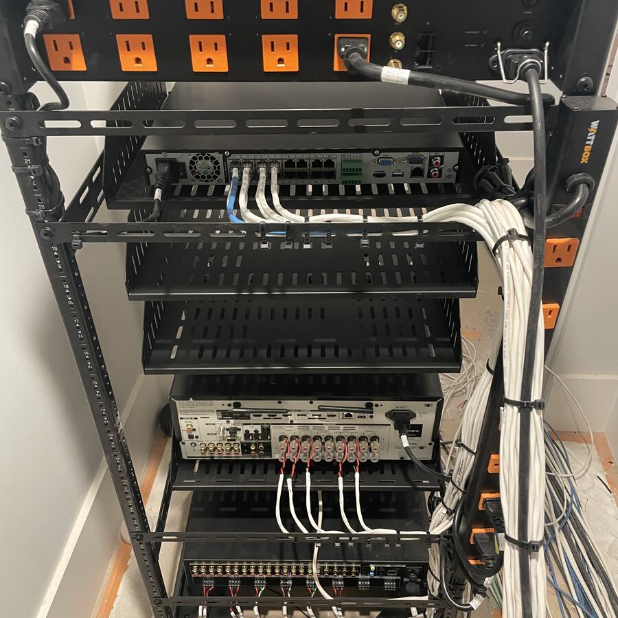 Equipment rack with network gear, amplifiers and bundled, dressed cabling